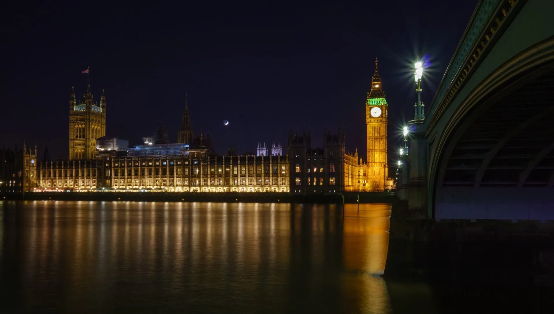 The Houses of Parliament across the River Thames at dusk